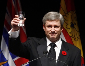 Stephen Harper raises his glass for a toast.